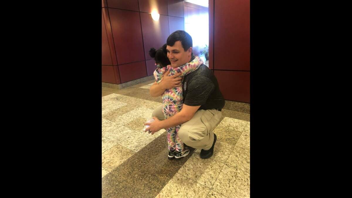A police officer reunited with a girl he saved from choking two years ago in South Carolina. (Photo credit: North Charleston Police Department)