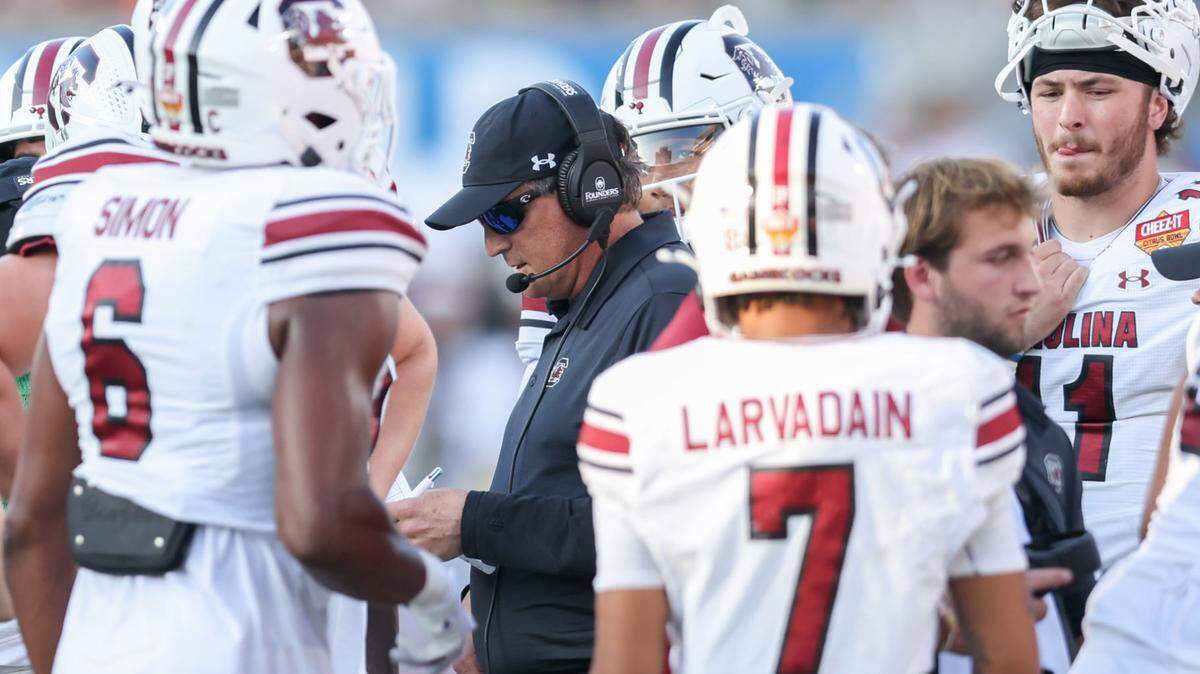 Offensive coordinator Mike Shula speaks to players during the first half of the Cheez-It Citrus Bowl at Camping World Stadium in Orlando, Florida on Tuesday, December 31, 2024.