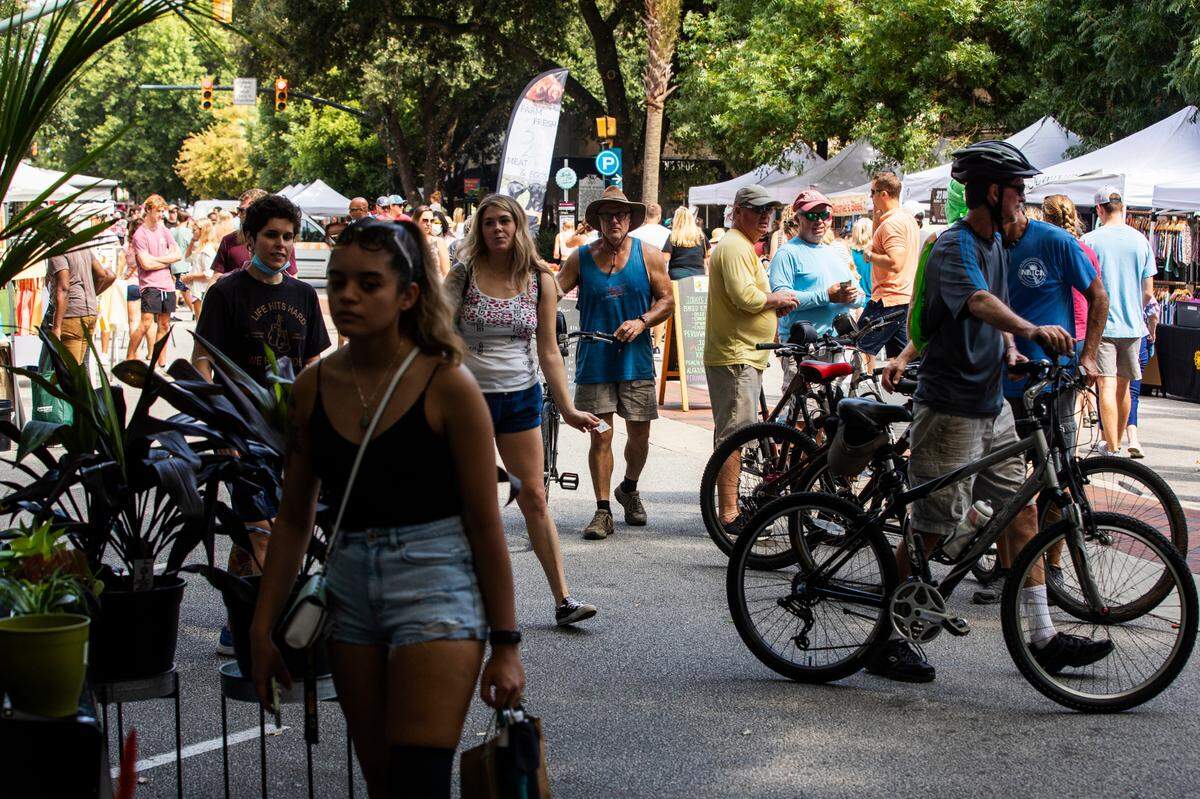People shop at Soda City Market in downtown Columbia, South Carolina on Saturday, August 21, 2021. The market stretches multiple blocks with vendors from all over South Carolina.