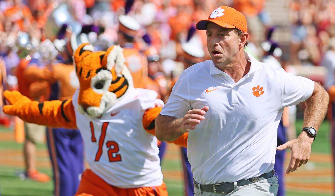 Clemson head coach Dabo Swinney runs onto the field before the North Carolina State game in Clemson, S.C. on Saturday, Sept. 21, 2024.