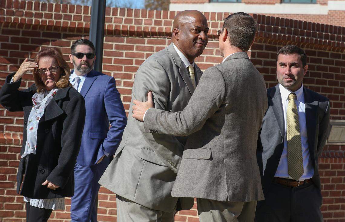 Suspended Chester County Sheriff Alex Underwood, left, embraces his former chief deputy Robert Sprouse outside the Matthew J. Perry Federal Courthouse in Columbia. Underwood, Sprouse and former Lt. Johnny Neal are facing charges in federal court.
