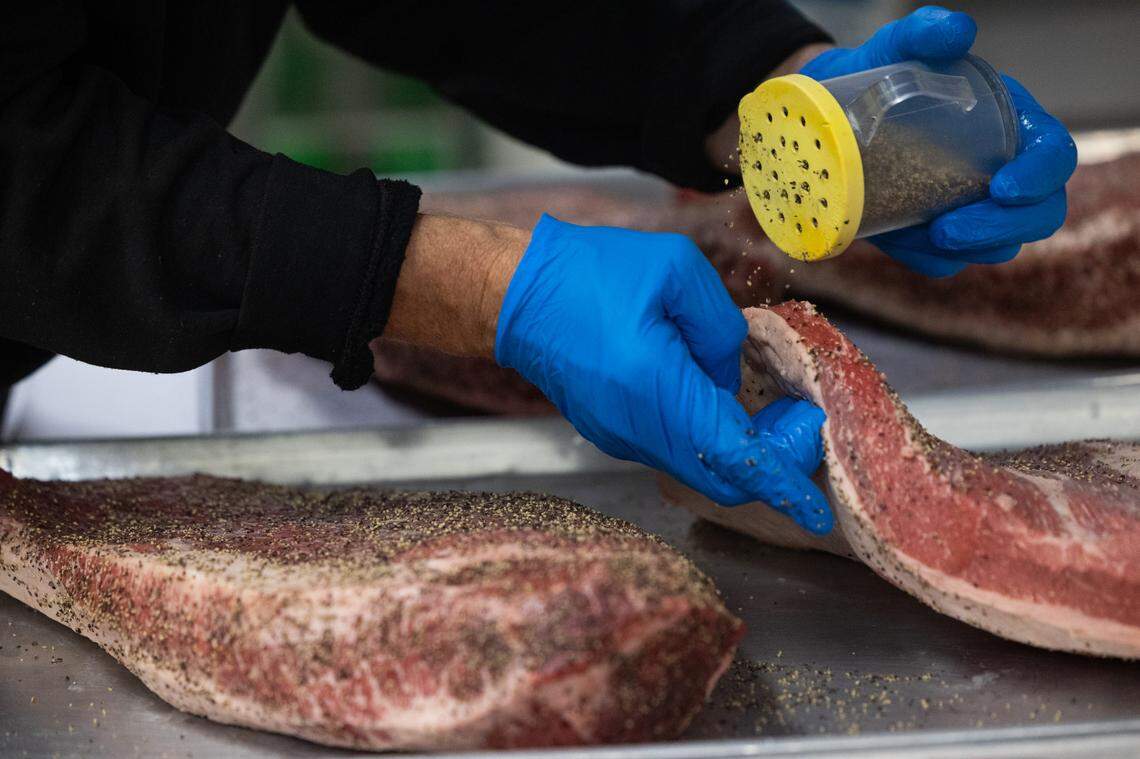 Robbie Robinson, owner of City Limits Barbeque in West Columbia, prepares over a dozen briskets before dawn on Friday, March 28, 2025.