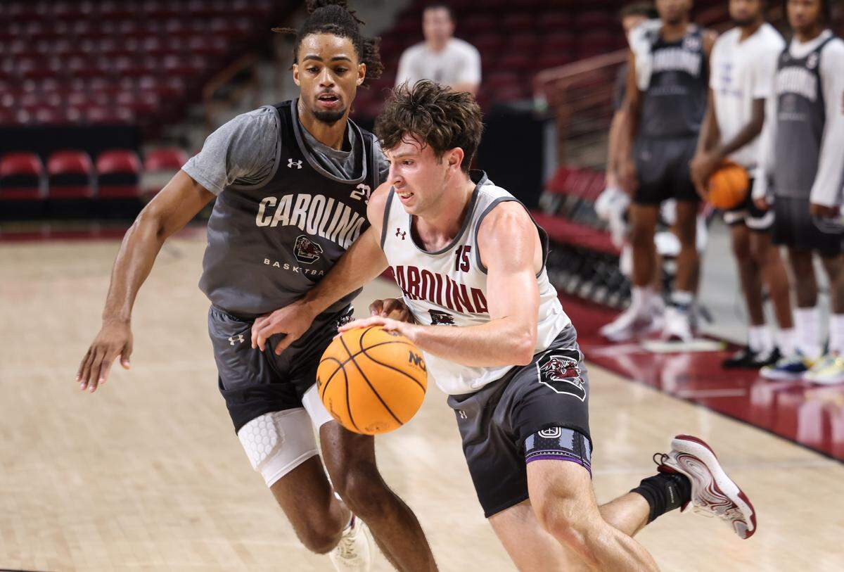 South Carolina guard Eli Ellis (15) is guarded by guard Cam Scott (23) during practice at Colonial Life Arena in Columbia on Wednesday, July 30, 2025.