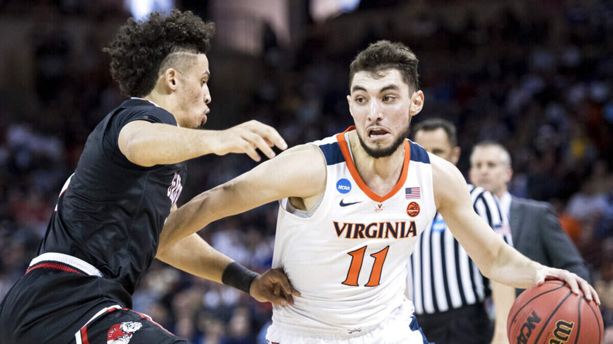 Virginia guard Ty Jerome (11) dribbles the ball against Gardner-Webb guard Jose Perez, left, during a first-round game in the NCAA men’s college basketball tournament Friday, March 22, 2019, in Columbia, S.C. (AP Photo/Sean Rayford)