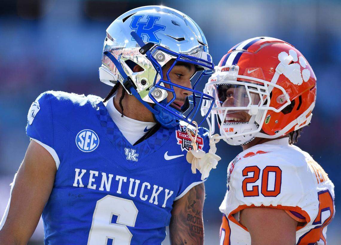 Kentucky Wildcats wide receiver Dane Key (6) carries Clemson Tigers cornerback Avieon Terrell (20) exchange words after Key took a long pass to the 5-yard line while being defended by Terrell during the first quarter. The Kentucky Wildcats faced off against the Clemson Tigers Friday, December 29, 2023, in the TaxSlayer Gator Bowl in Jacksonville, Florida.