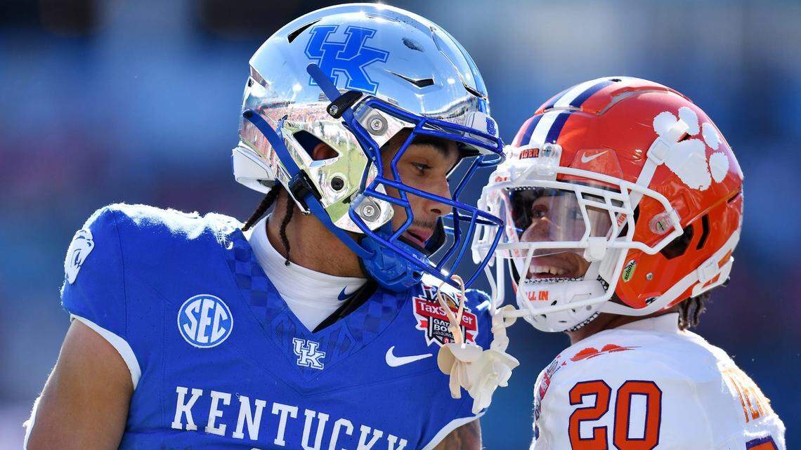 Kentucky Wildcats wide receiver Dane Key (6) carries Clemson Tigers cornerback Avieon Terrell (20) exchange words after Key took a long pass to the 5-yard line while being defended by Terrell during the first quarter. The Kentucky Wildcats faced off against the Clemson Tigers Friday, December 29, 2023, in the TaxSlayer Gator Bowl in Jacksonville, Florida.