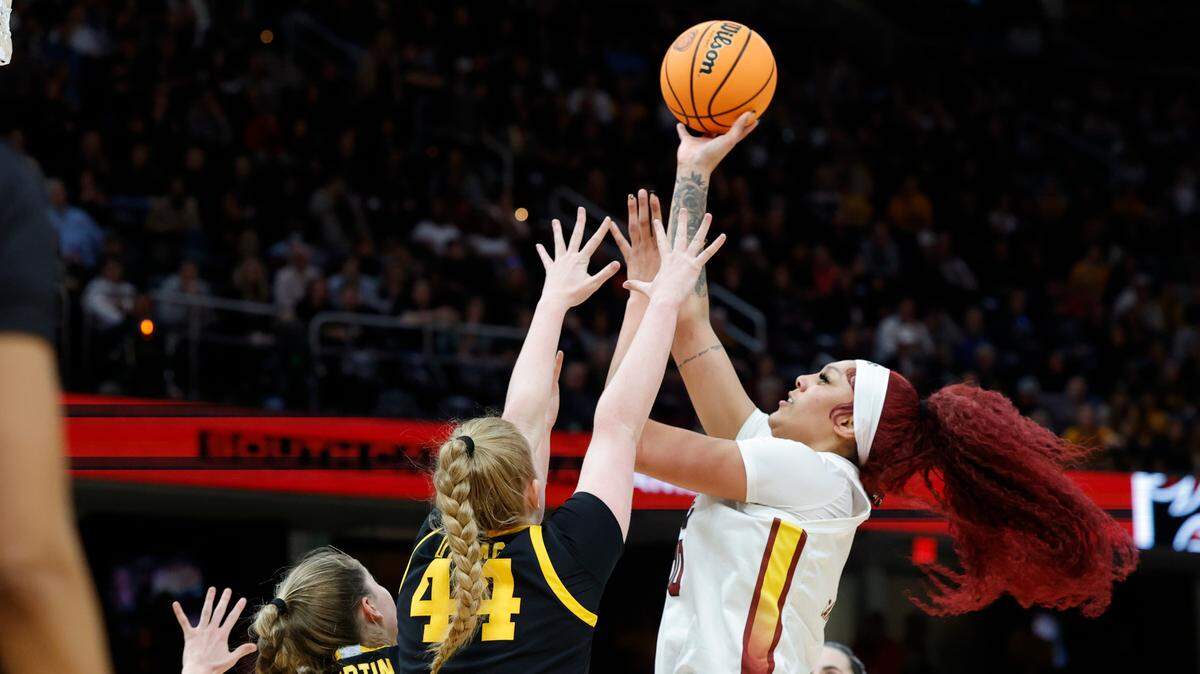 South Carolina’s Kamilla Cardoso (10) shoots as Iowa’s Addison O’Grady (44) pressures during the National Championship game at the Rocket Mortgage FieldHouse in Cleveland, Ohio on Sunday April 7, 2024.