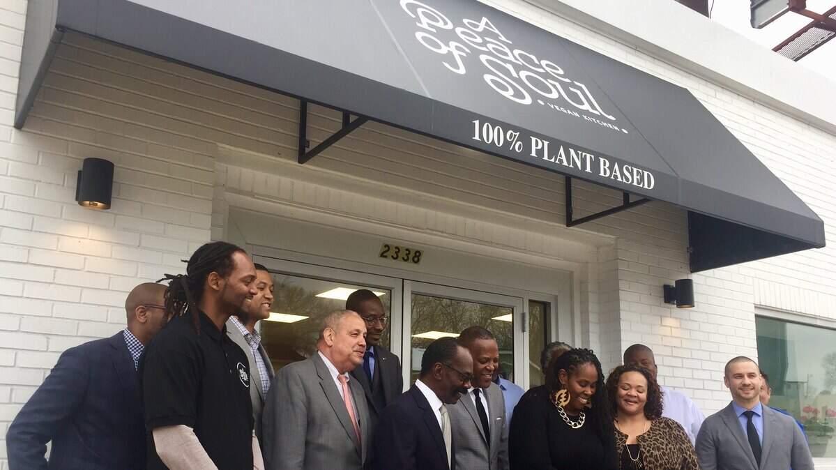 In this 2020 photo, Folami Geter cuts a ribbon to celebrate what was then the grand reopening of her restaurant, A Peace of Soul Vegan Kitchen, on North Main Street in Columbia.