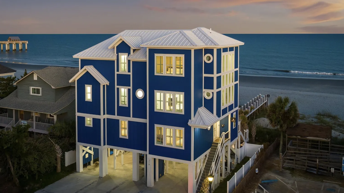 The house includes a four-car garage and comes with a golf cart.