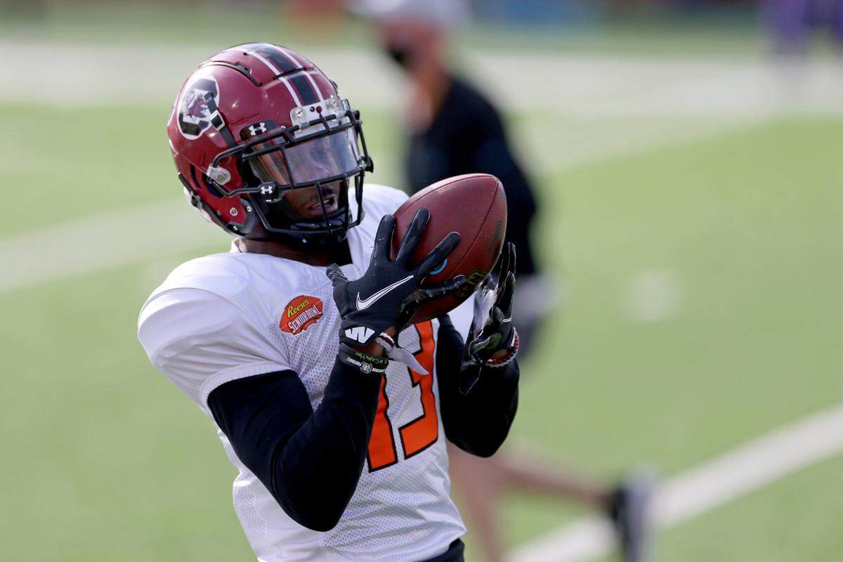American Team wide receiver Shi Smith of South Carolina (13) catches a pass during the American team practice for the NCAA college Senior Bowl in Mobile, Ala., Wednesday, Jan. 27, 2021. (AP Photo/Rusty Costanza)