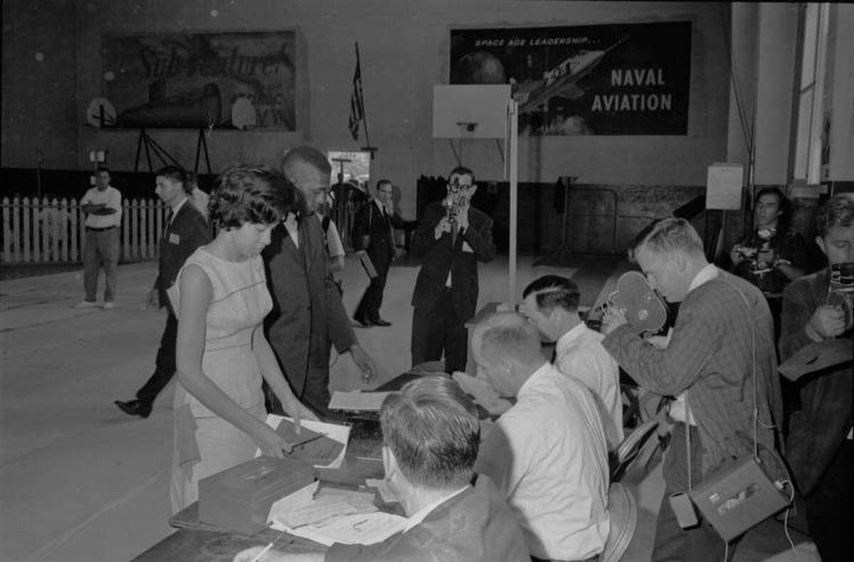 Henrie Monteith (left) and Robert G. Anderson register as students in the Administration Building at the University of South Carolina. They are two of the first three African-American students at the university since Reconstruction.
