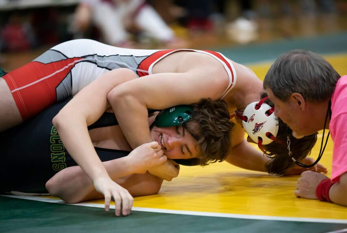 Austin Huff of Ben Lippen is wrapped up by Aiden Palisin of the Hammond School during the SCISA 2022 Duals State Wrestling Tournament at Ben Lippen on Saturday, February 5, 2022.