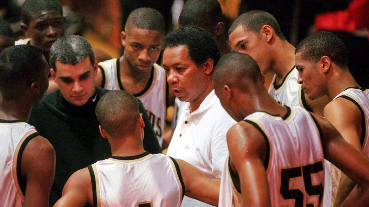 Legendary basketball coach Carl Williams, center, won state titles at Booker T. Washington, AC Flora and Lower Richland high schools.