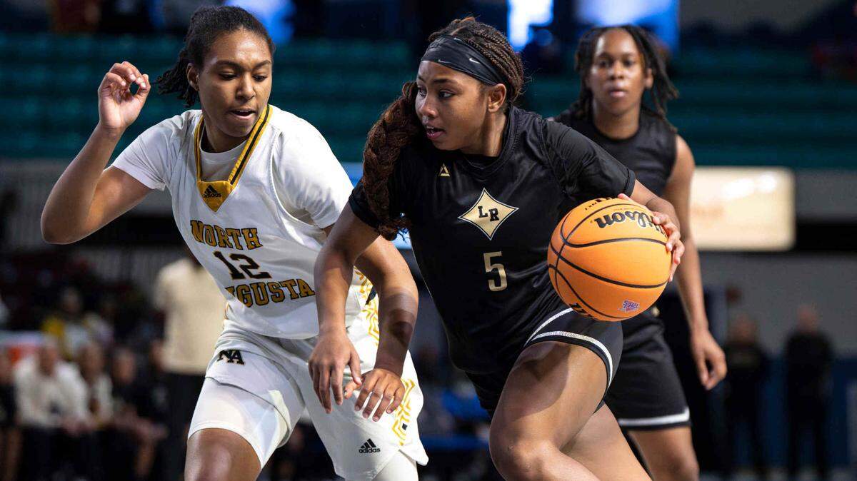 Lower Richland point guard Chi’Nya Issac (5) drives the ball in the first half during the Lower Richland vs. North Augusta SCHSL Class 4A Lower State girls basketball championship on March 3, 2025 in Florence.