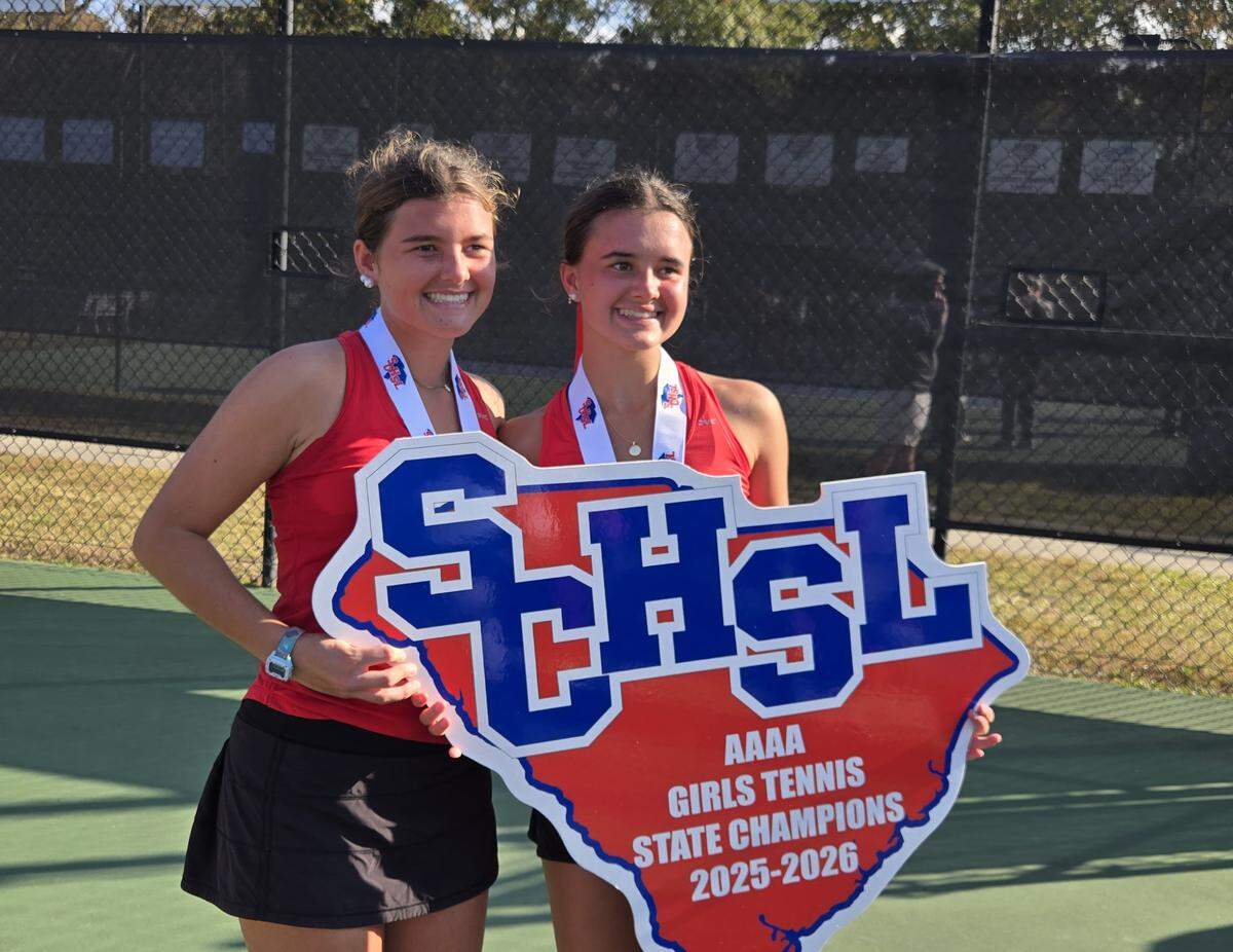 Sisters Catherine and Emily Smith celebrate after helping AC Flora to win the Class 4A girls tennis championship on Nov. 8, 2025.