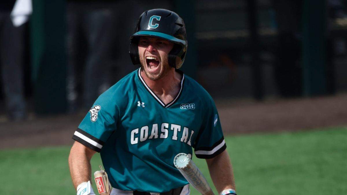 Coastal Carolina Chanticleer’s Wells Sykes (20) celebrates getting hit by a pitch that put him on base advanving the runners and scoring a run late against Auburn during game two of the NCAA Baseball Super Regonal at Plainsman Park in Auburn, Ala., on Friday June 6, 2025.