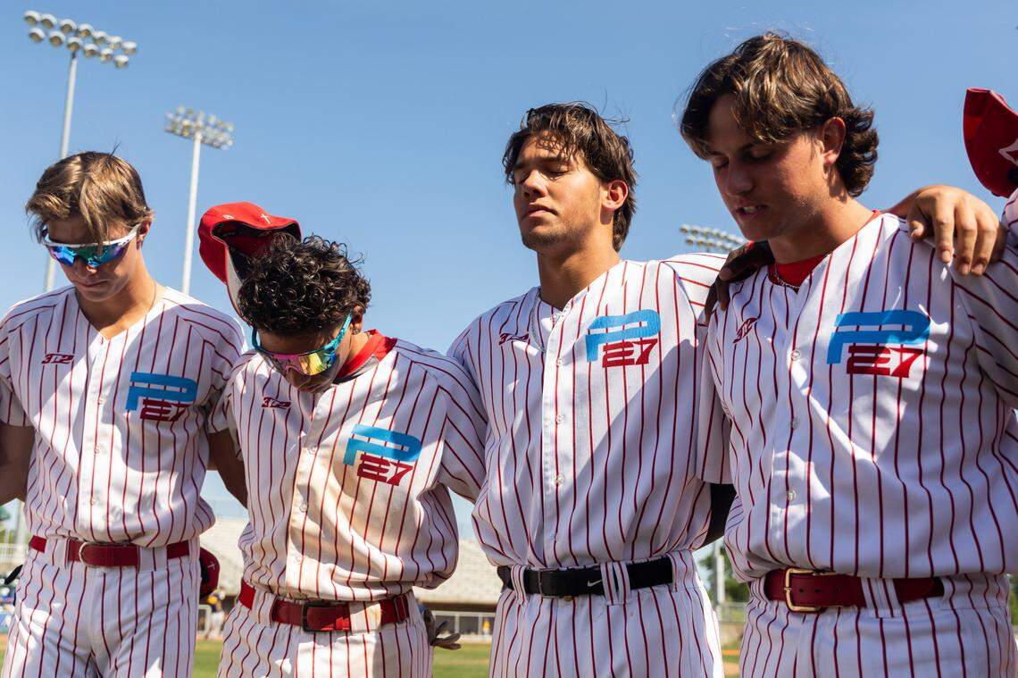 Wagner, second from right, often volunteers to lead the academy players in prayer.