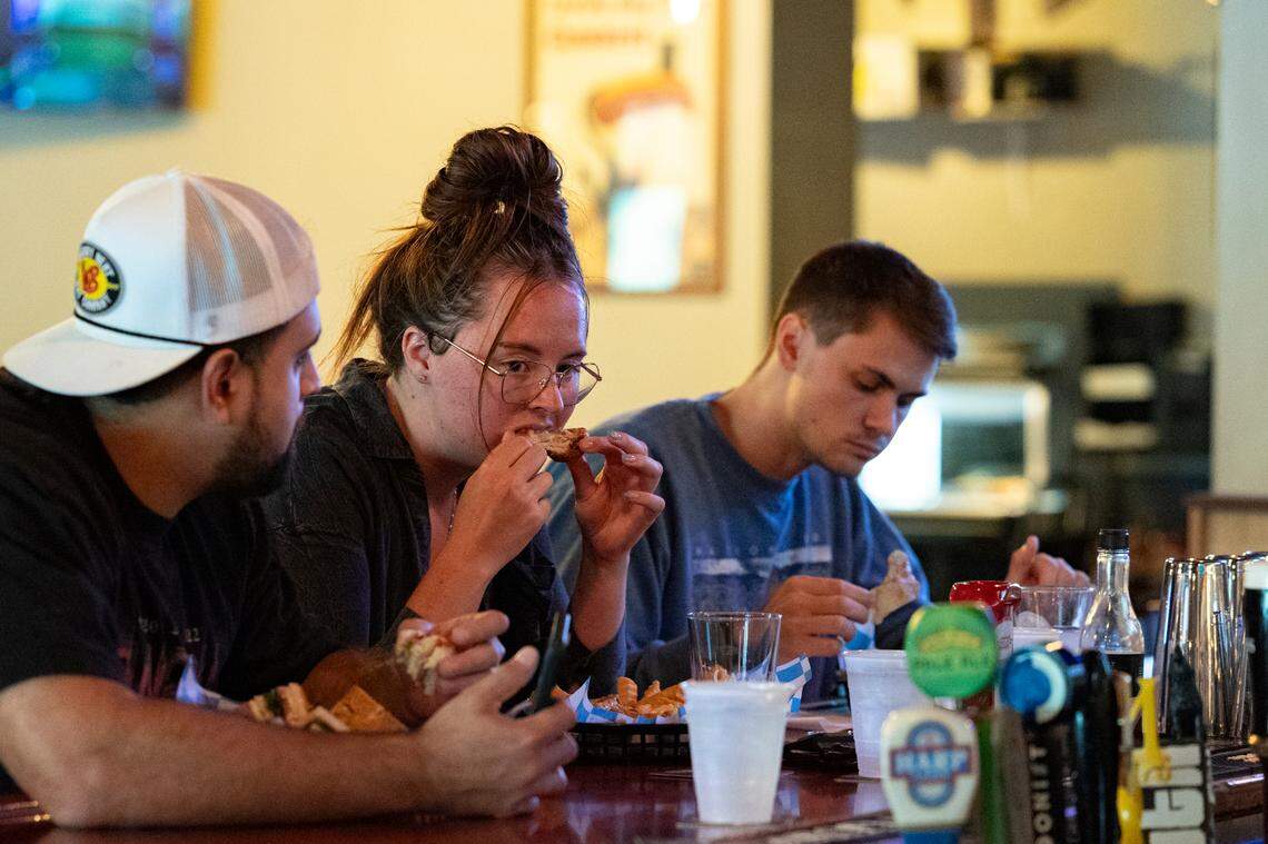 Mario Villegas, Madison Burlett and Austin Shealy dine at Publick House.