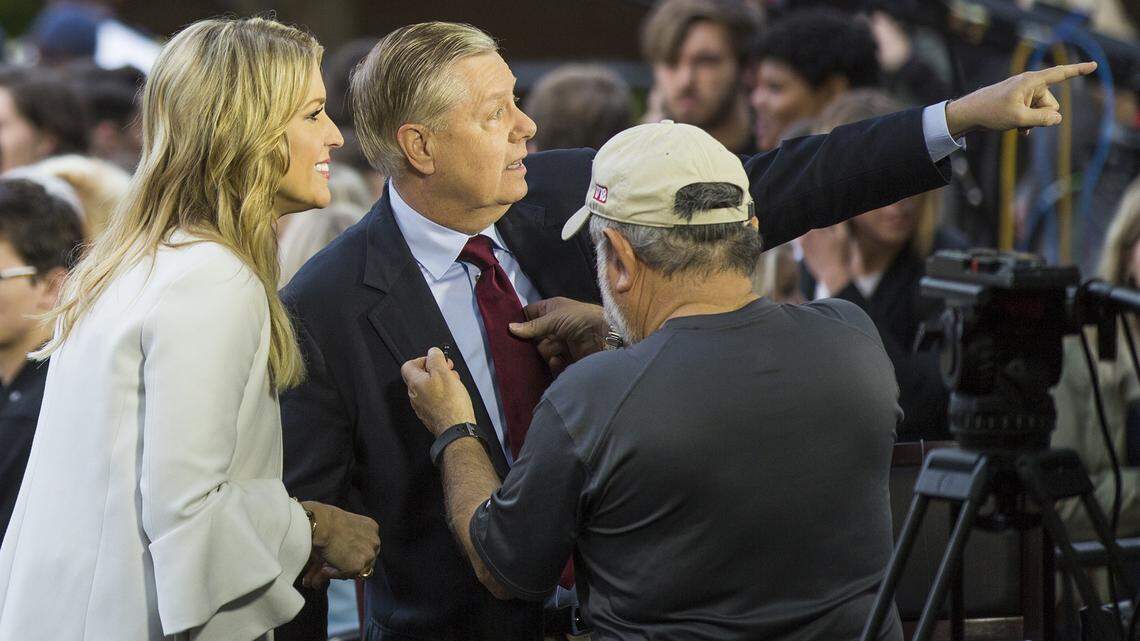 Ainsley Earhardt, cohost of "Fox and Friends" and USC alumna, talks to Sen. Lindsey Graham, R-S.C., after an interview during her broadcast from Davis Field on the University of South Carolina campus in Columbia, SC, Friday  April 27, 2018.