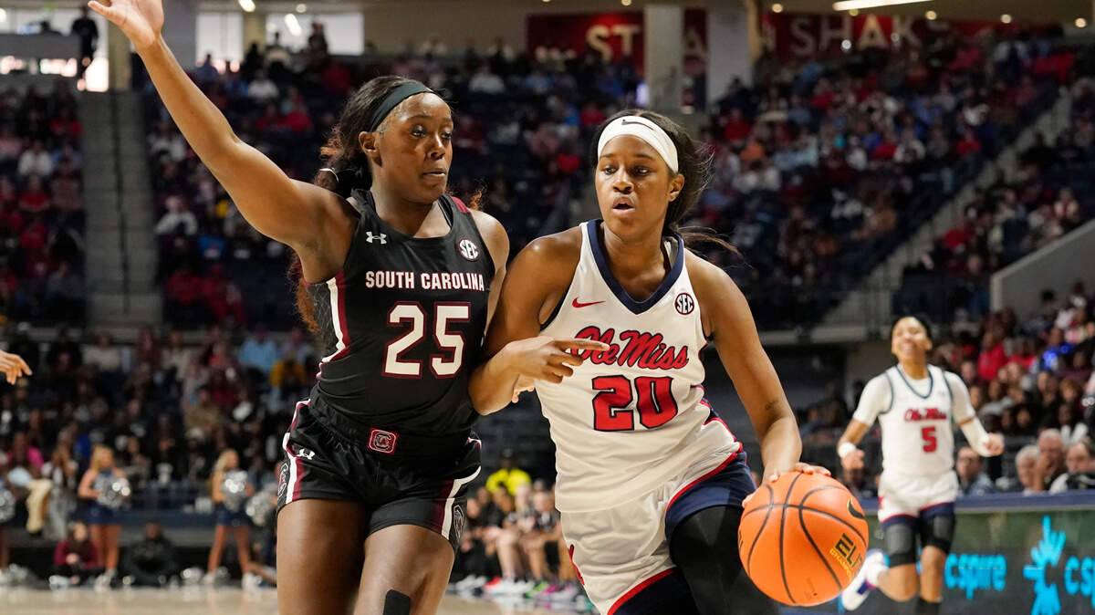 Mississippi guard Ayanna Thompson (20) attempts to dribble past South Carolina guard Raven Johnson (25) during the second half of an NCAA college basketball game in Oxford, Miss., Sunday, Feb. 19, 2023. South Carolina won in overtime 64-57. (AP Photo/Rogelio V. Solis)