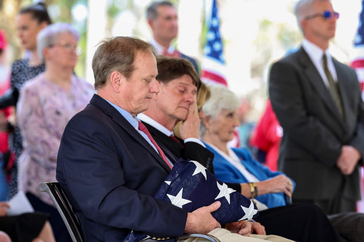Brothers Billy, left, and David Crossland attend the military funeral of their uncle, WWII veteran Arthur William Crossland, Jr.