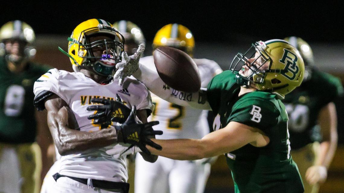 Spring Valley Vikings defensive end Mondell Hutto (9) and River Bluff Gators tight end Blaine Blose (81) battle for a passed ball.