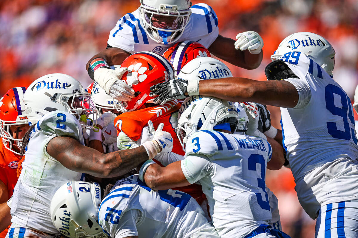 The Duke Blue Devils defense swarm Antonio Williams #0 of the Clemson Tigers during the first half of their game last week.