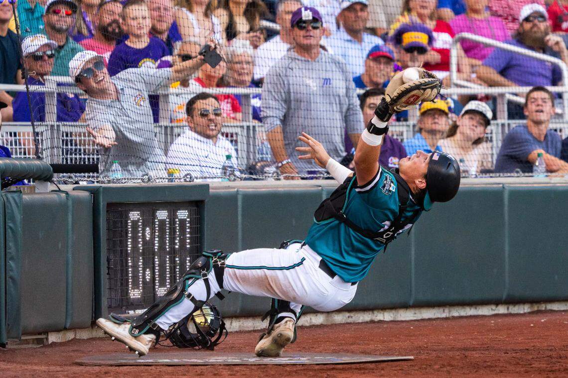 Coastal Carolina Chanticleers catcher Caden Bodine (17) catches for an out against the LSU Tigers during the third inning at Charles Schwab Field.