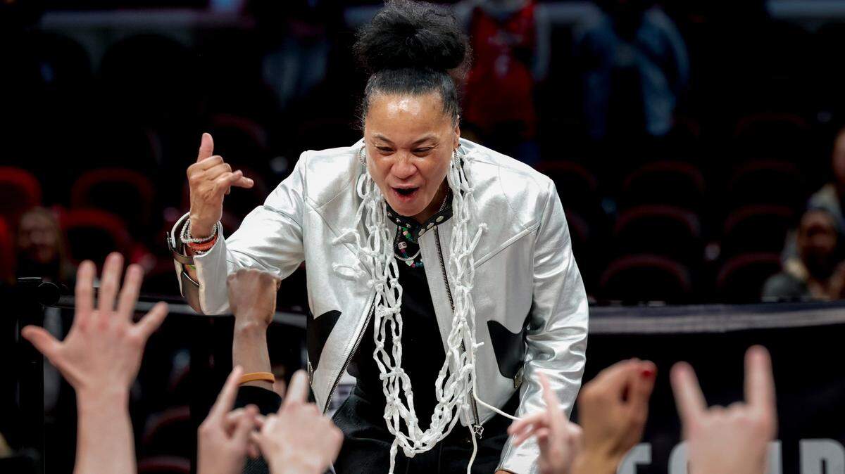 University of South Carolina Head Coach Dawn Staley interacts with her players after The Gamecocks won the National Championship game against Iowa at the Rocket Mortgage FieldHouse in Cleveland, Ohio on Sunday April 7, 2024.
