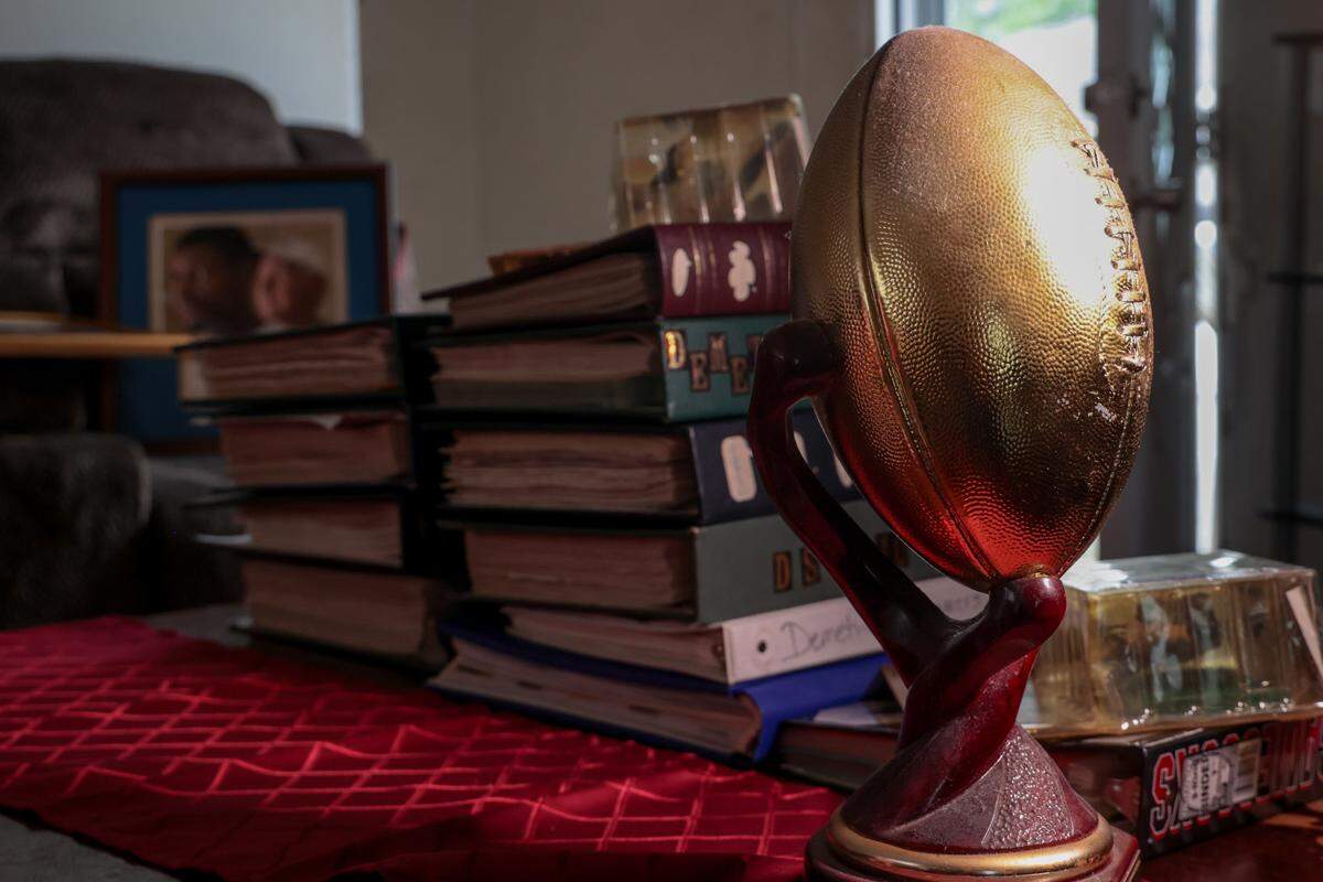 Jacqueline Summers created a dozen scrapbooks of son Demetris Summers’ football seasons. They’re still prominently displayed in her Lexington home.