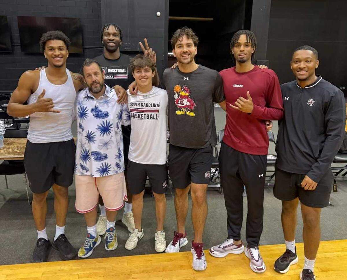 Comedian Adam Sandler (Hawaiian shirt) with members of the South Carolina men’s basketball program at Carolina Coliseum on Sept. 10, 2025