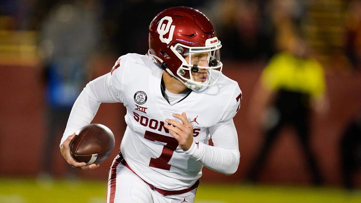 Oklahoma quarterback Spencer Rattler scrambles up field during the first half of an NCAA college football game against Iowa State, Saturday, Oct. 3, 2020, in Ames, Iowa. (AP Photo/Charlie Neibergall)