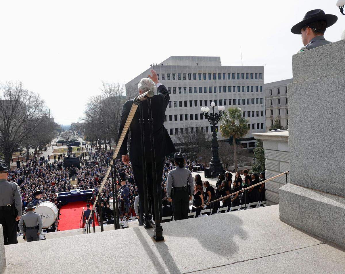 S.C. Gov. Henry McMaster waves at the crowd as he walks to his inauguration ceremony on Wednesday, Jan. 11, 2023, in Columbia, S.C.