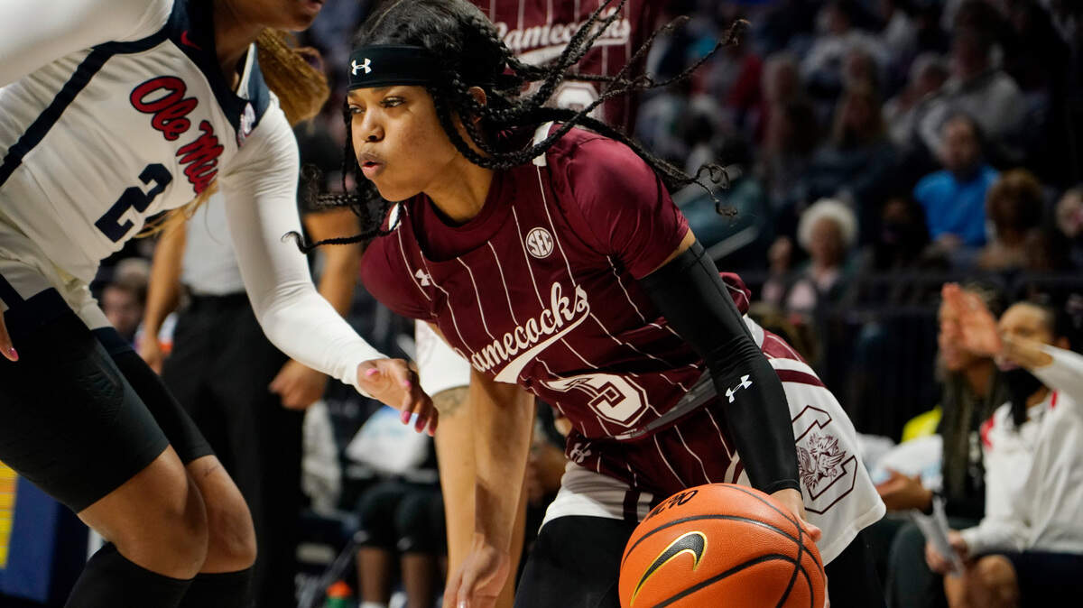 South Carolina guard Destanni Henderson (3) attempts to dribble past Mississippi guard Mimi Reid (2) during the first half of an NCAA college basketball game in Oxford, Miss., Sunday, Feb. 27, 2022.