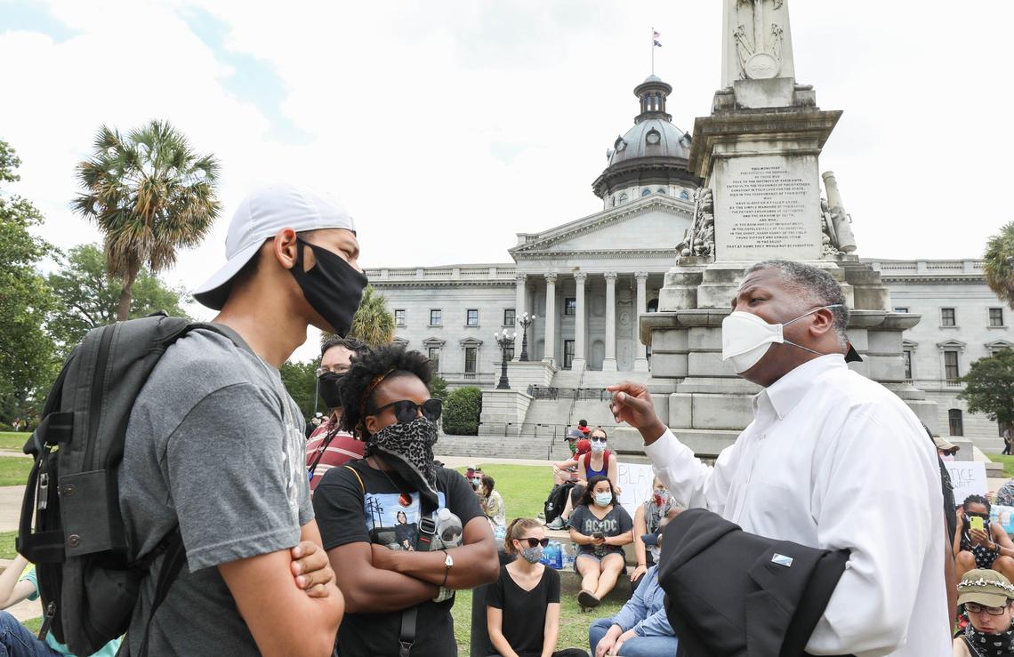 Columbia mayor Steve Benjamin speaks with group organizer Lawrence Nathaniel and Dremetris Hill before a peaceful protest at the South Carolina Statehouse. Protesters gathered in Columbia to demonstrate their anger at how George Floyd was killed while being arrested in Minneapolis. 6/1/20