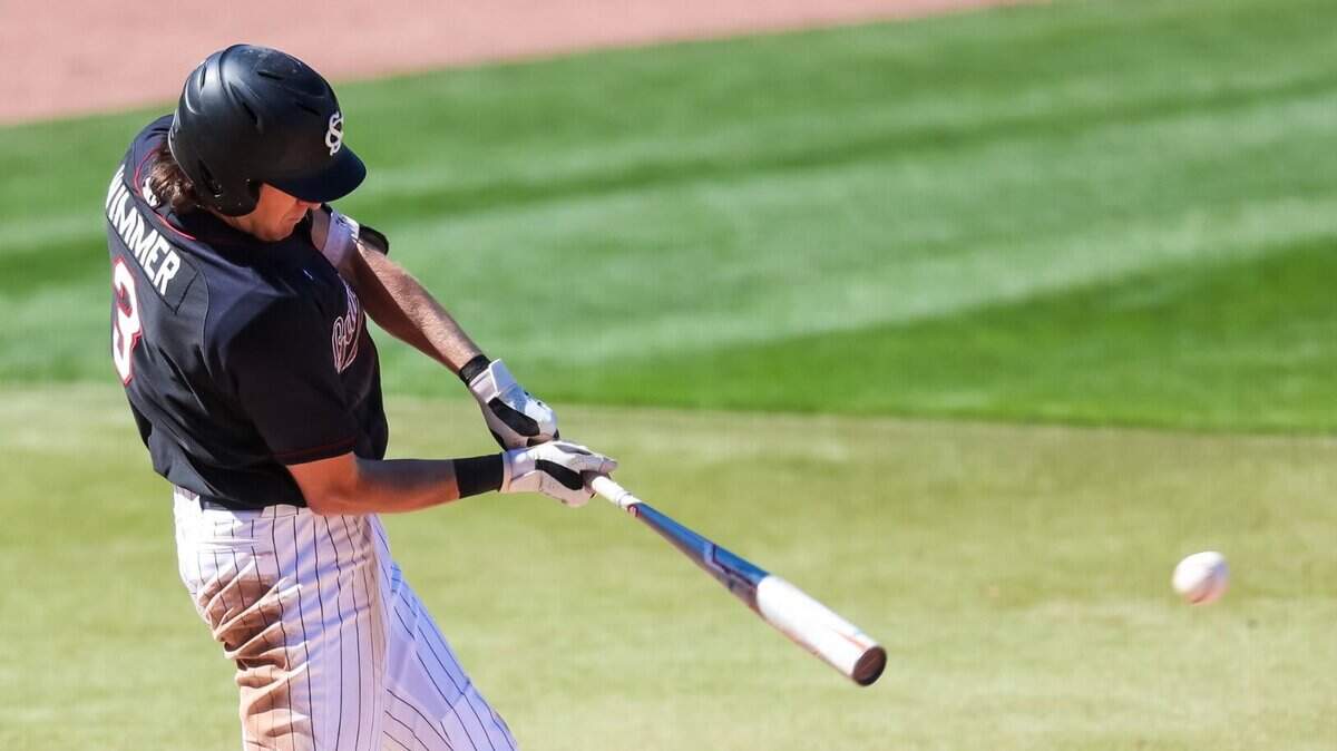South Carolina Gamecocks shortstop Braylen Wimmer (3) hits an RBI single in the 5th inning against the Texas Longhorns during the first game game of their double header at Founders Park Sunday, March 13, 2022.