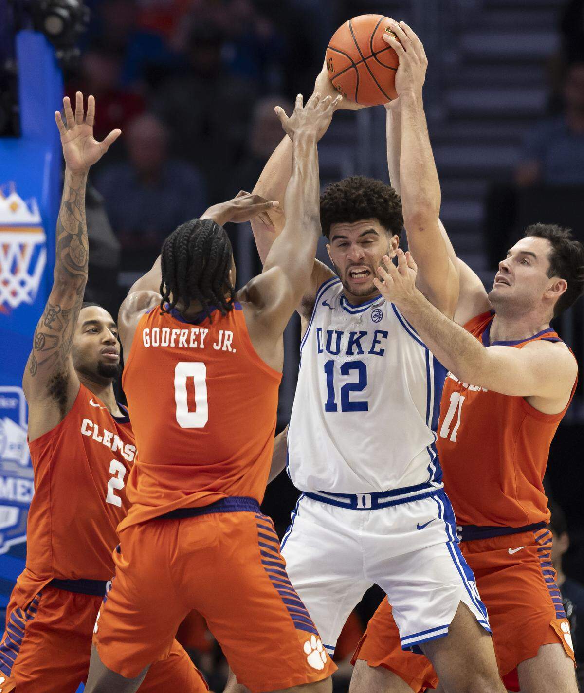 Clemson guard Dillon Hunter (2) and forwards RJ Godfrey (0) and Nick Davidson (11) trap Duke forward Cameron Boozer in the second half on Friday, March 13, 2026, during the semifinals of the ACC Tournament at Spectrum Center in Charlotte, North Carolina. Cameron Boozer led all scores with 24 points in the Blue Devils’  73-61 victory. 