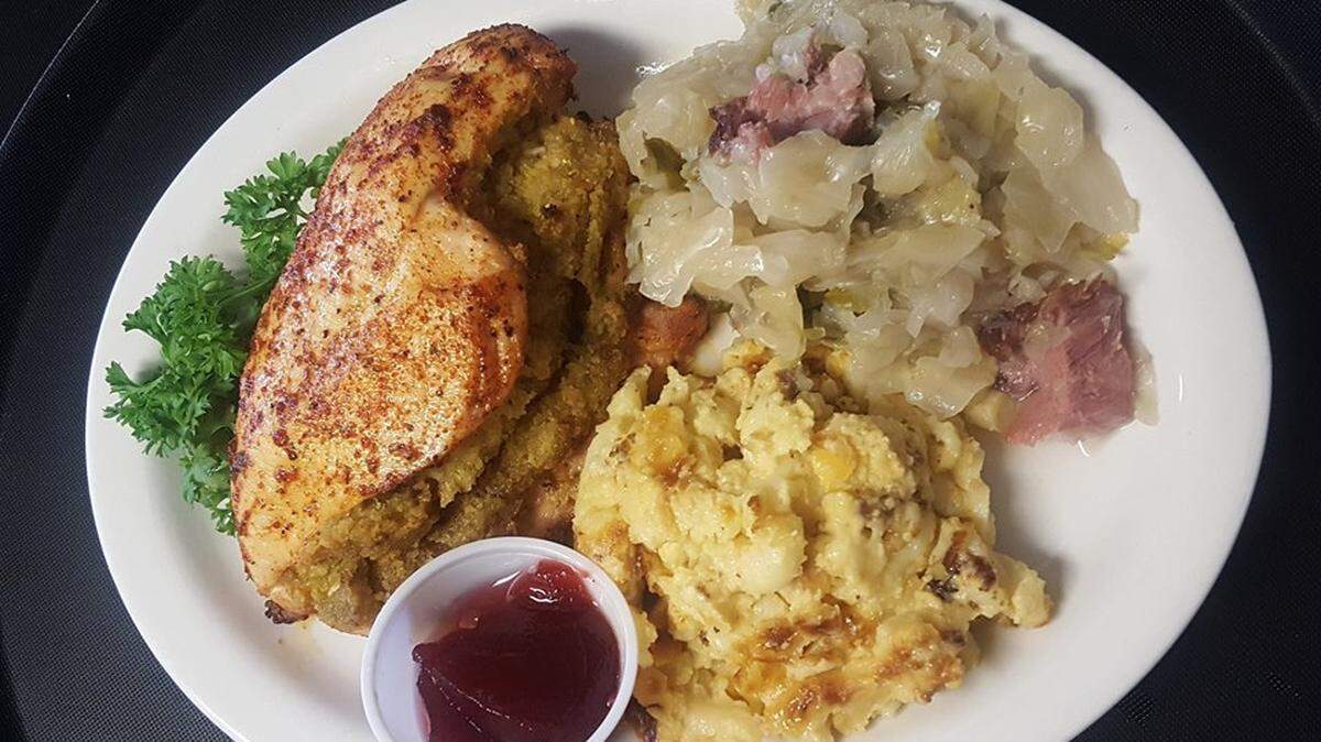 Stuffed chicken breast with with homemade macaroni and cheese and cabbage at Manna Cafe Family Restaurant in Batesburg.