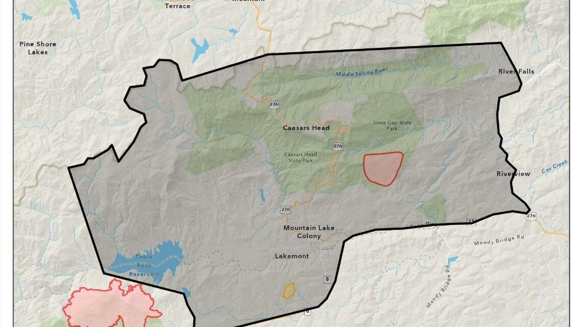 A map showing the sites of two wildfires and the mandatory evacuation areas around them in Pickens and Greenville Counties.