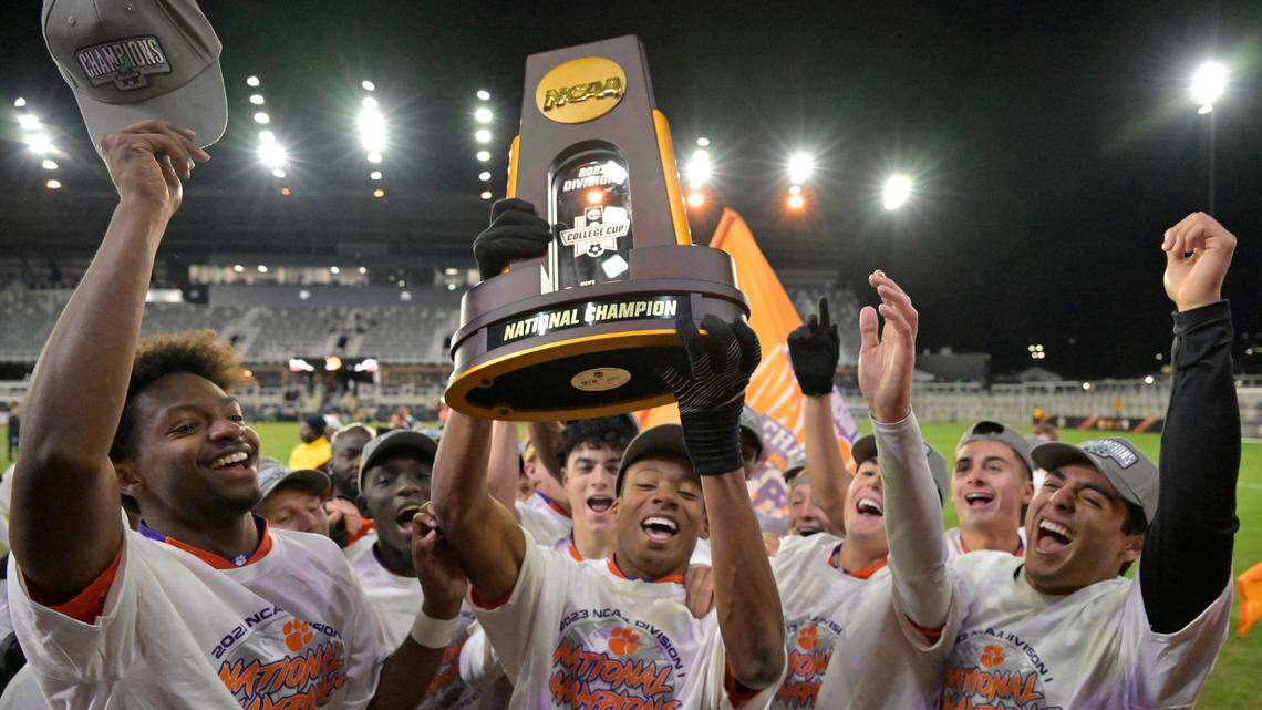 The Clemson Tigers celebrate with the trophy after defeating the Notre Dame Fighting Irish the College Cup Championship at Lynn Family Stadium. Clemson defeated Notre Dame 2-1.
