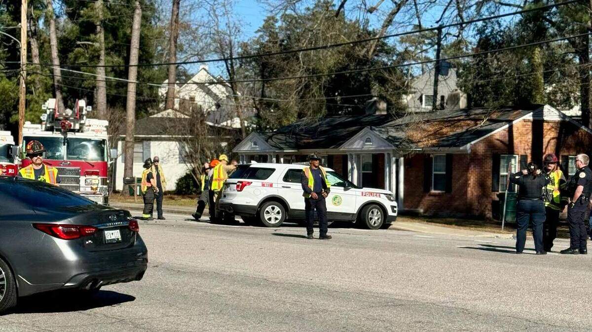 Firefighters with the Columbia Fire Department helped rescue a Forest Acres police officer trapped in his car following a crah on Tenholm Road on Sunday, Jan 14, 2024.