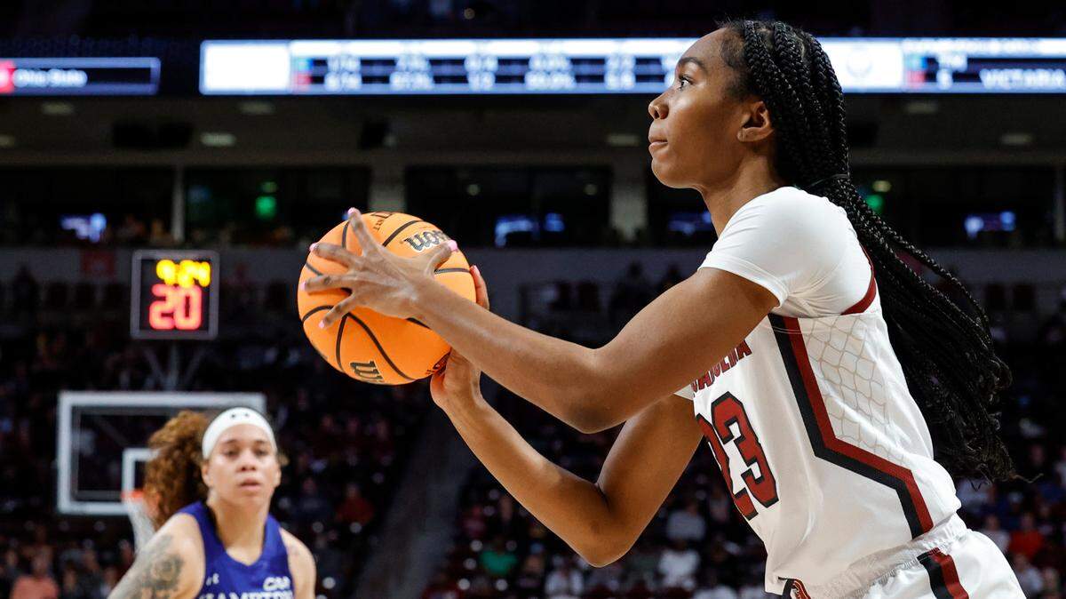 South Carolina’s Bree Hall (23) shoots ahead of pressure from Hampton’s Madison Buford (12) during the first half of action in the Colonial Life Arena on Sunday, Nov. 27, 2022.
