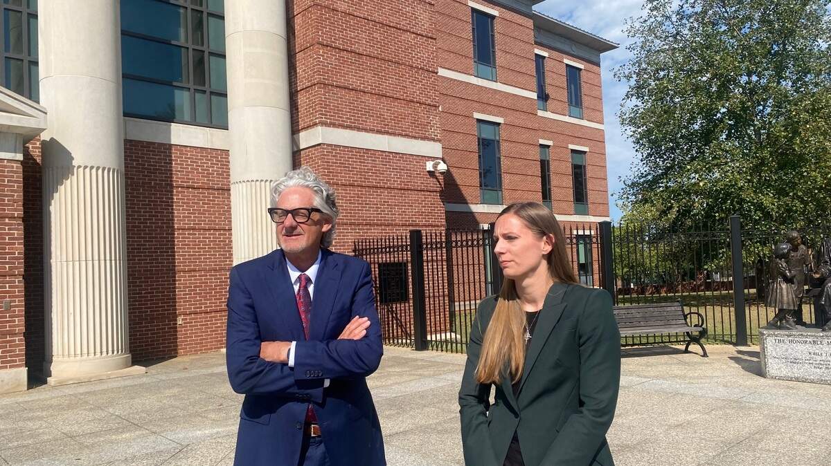 John Blume and Lindsey Vann, lawyers for condemned death row inmate Richard Moore, talk to reporters Tuesday, Oct. 15, 2024, after a federal court hearing in Columbia, S.C.