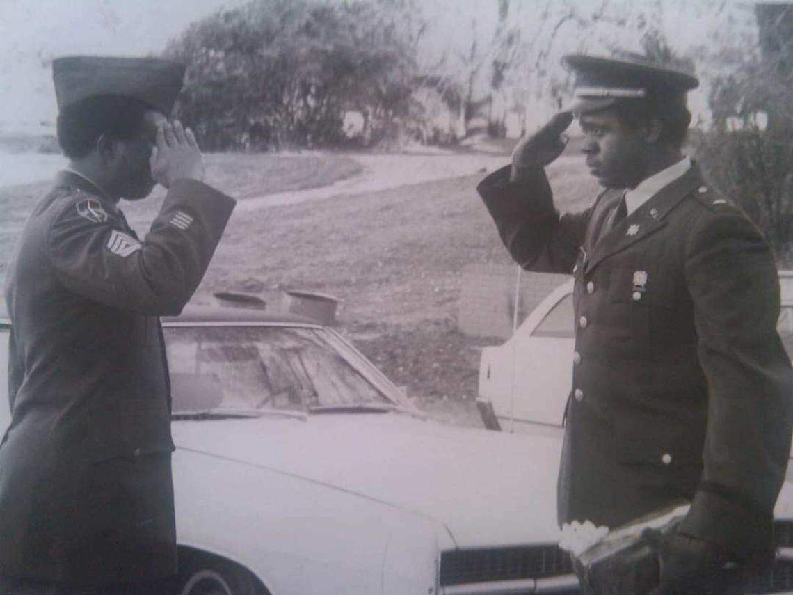 Terry Barrett, right, pictured in his Army uniform.