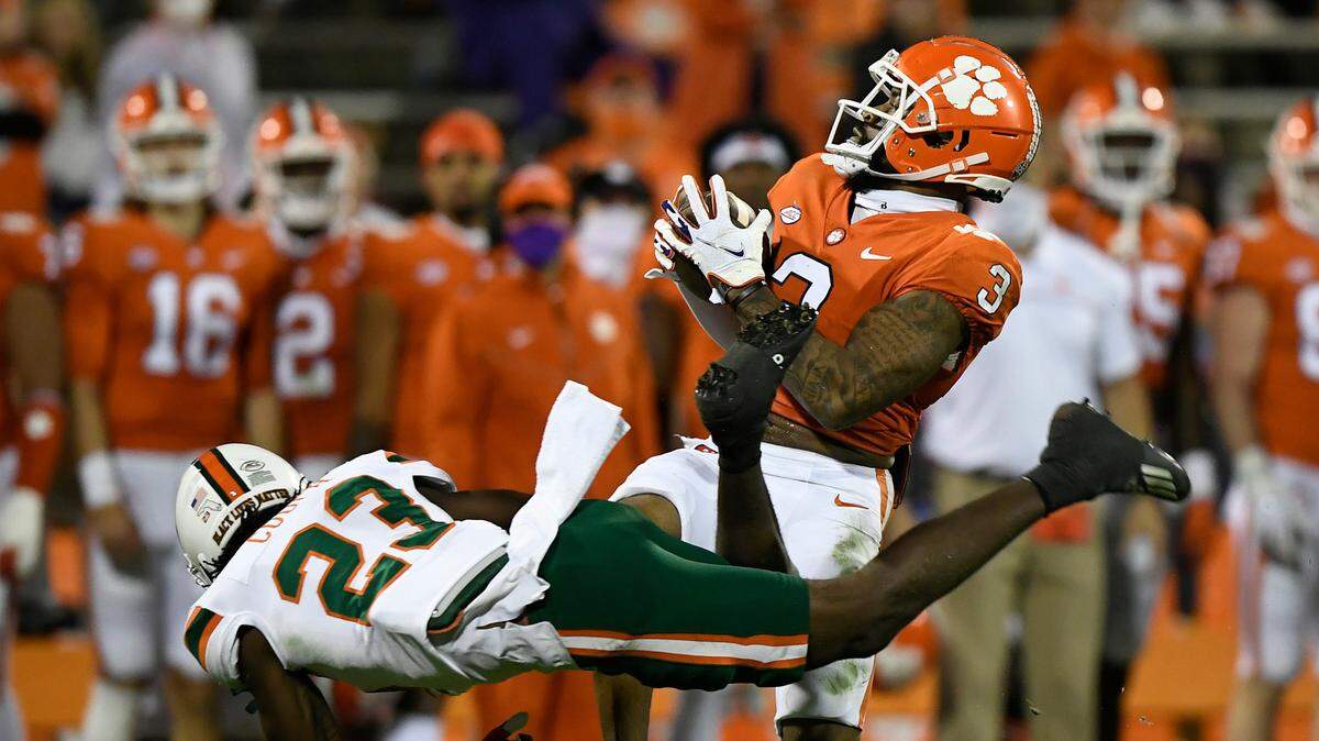 Miami cornerback Te’Cory Couch (23) tries to bring down Clemson wide receiver Amari Rodgers (3) during the 2nd quarter during Clemson’s game against the University of Miami at Clemson’s Memorial Stadium Saturday, October 10, 2020.
