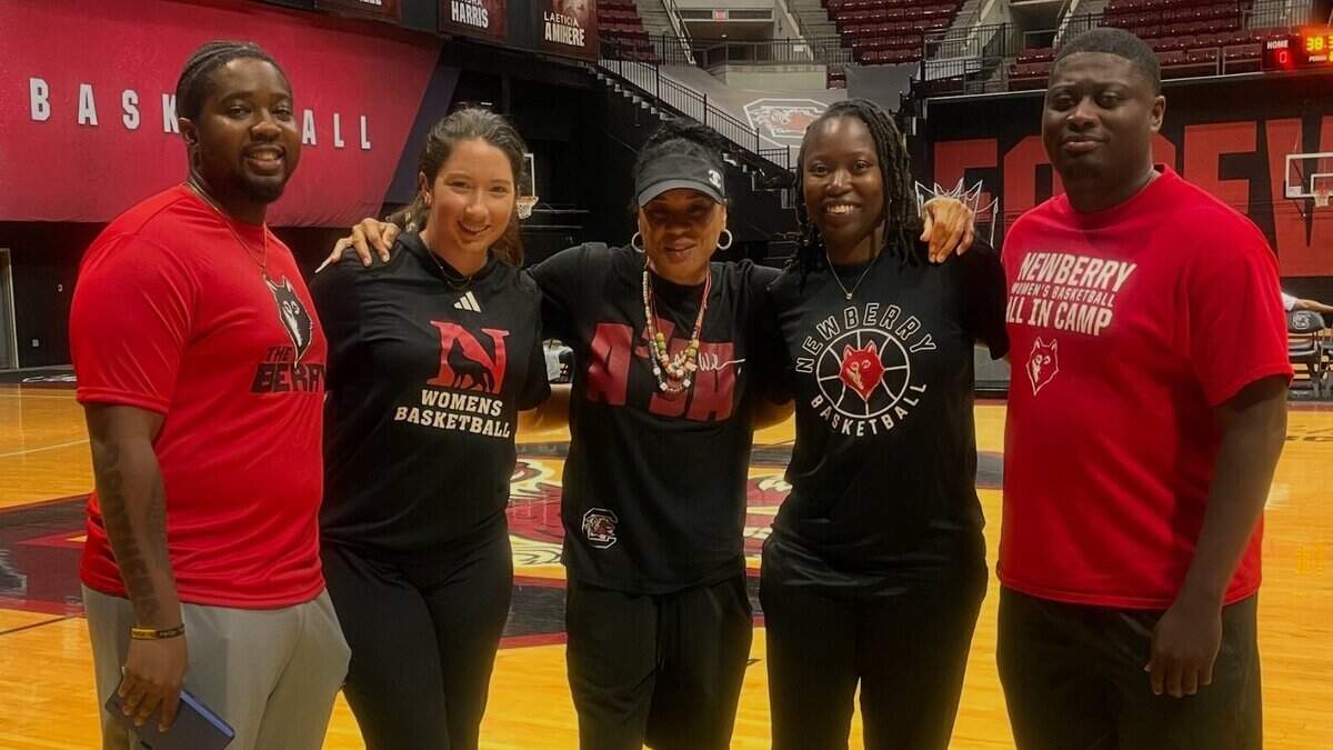 South Carolina women’s basketball coach Dawn Staley (center) poses with members of the Division II Newberry women’s basketball team including coach Johnette Walker (second from right) on July 3