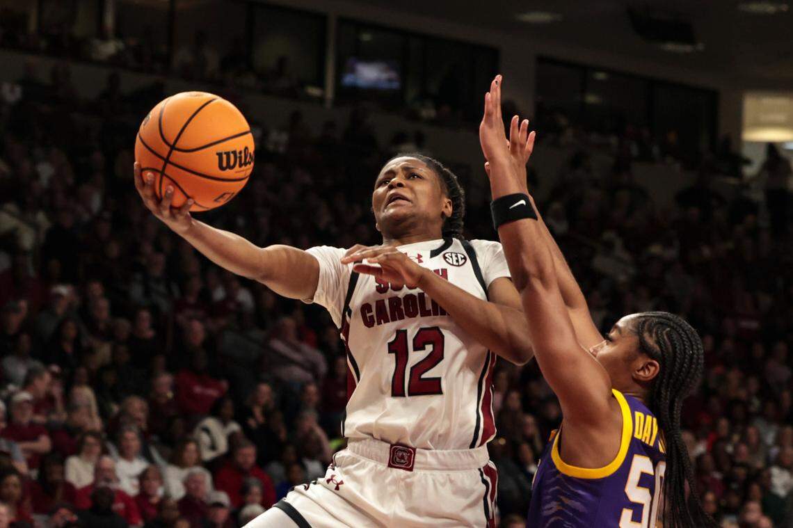 University of South Carolina’s  MiLaysia Fulwiley (12) shoots as Louisiana State University’s Shayeann Day-Wilson (50) pressures during the second half of action in the Colonial Life Arena on Friday, Jan. 24, 2025.