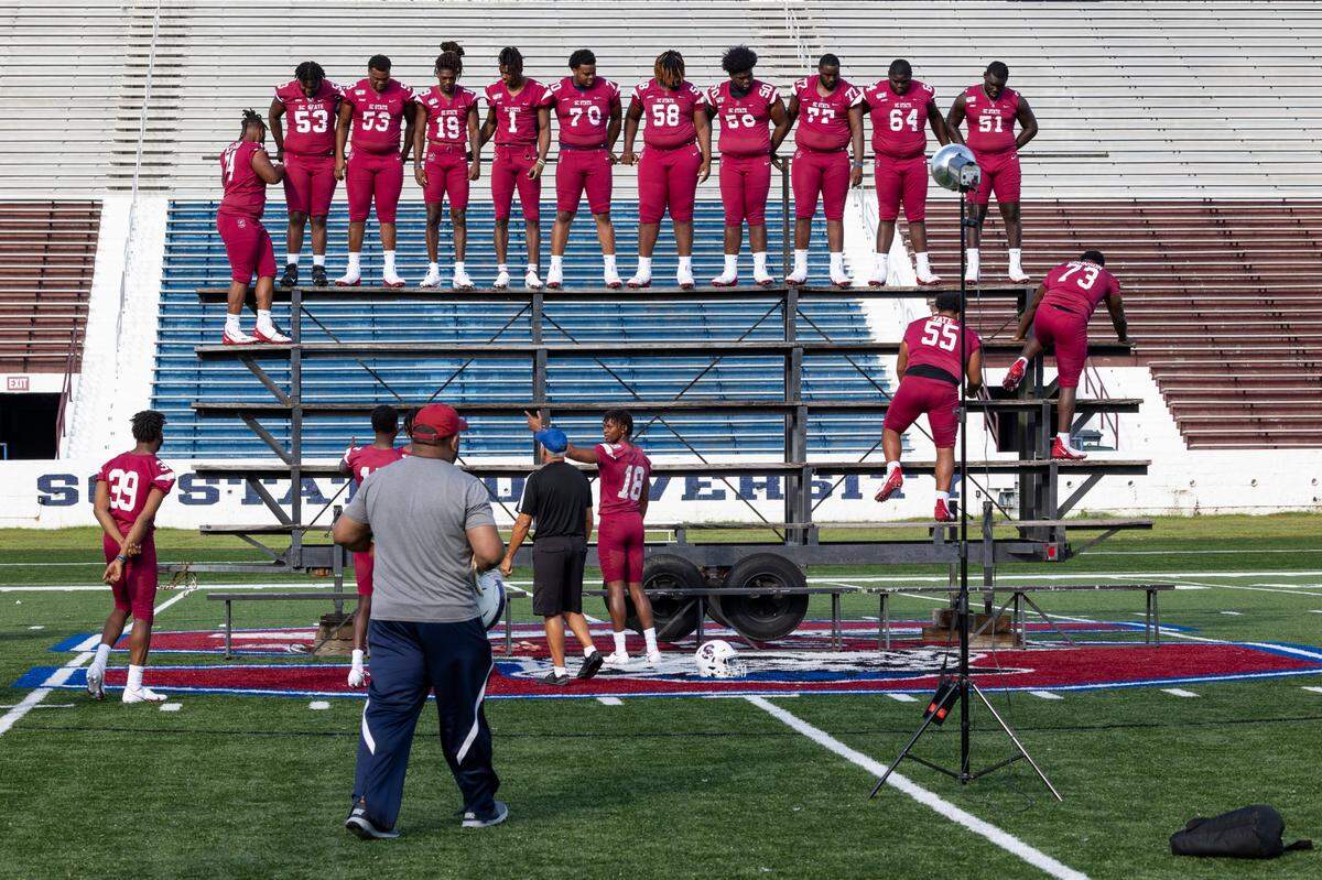 South Carolina State football players prepare for the team photo Aug. 13 at the Bulldogs’ on-campus media day. S.C. State’s expectations this season are as high as ever as after last season’s HBCU national championship win over Jackson State.