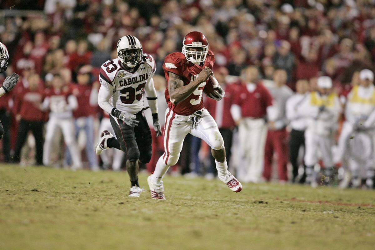 From Nov. 3, 2007: South Carolina’s Chris Hampton can’t find a handle on Arkansas tailback Darren McFadden at Reynolds Razorback Stadium..