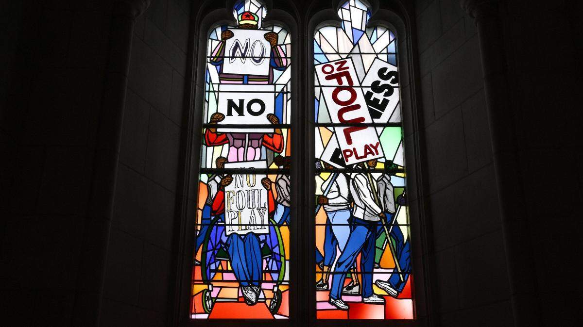 Light shines through new stained-glass windows with a theme of racial justice during an unveiling and dedication ceremony at the Washington National Cathedral for the windows in 2023. The windows depicting a march for justice by African Americans replaced ones honoring Confederate Gens. Robert E. Lee and Andrew “Stonewall” Jackson. (AP Photo/Nick Wass)